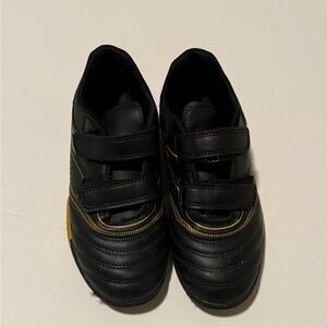 Stylish Black Sneakers with Gold Details